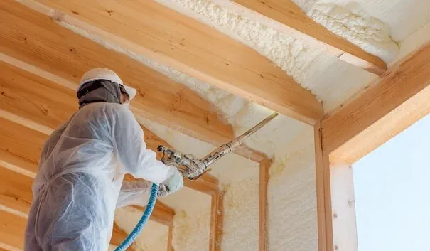 Foam insulation sprayed along the underside of a roofline